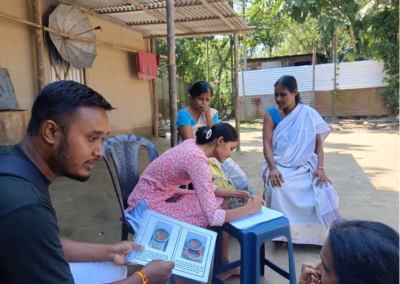ASHA health worker communicating at a household