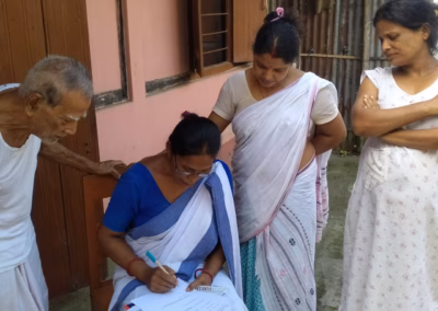 ASHA health worker communicating at a household